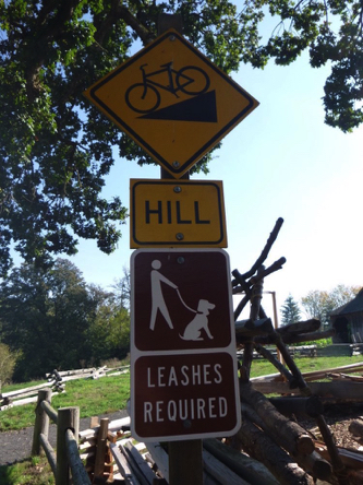 Sign at start of trail by visitor center – dogs must be on leash – sign shows steep trail grade ahead